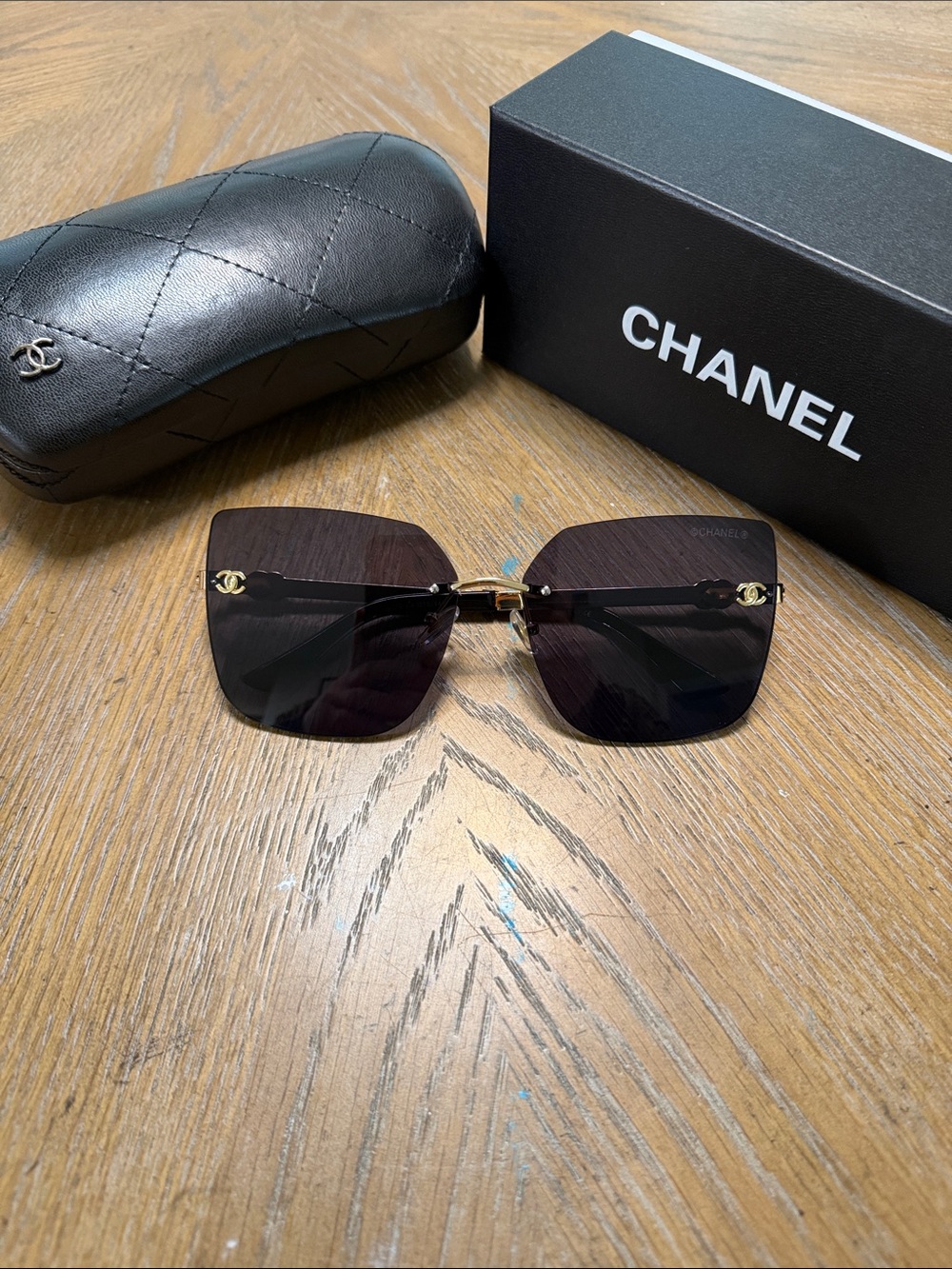 CHANEL Black Rimless Square Sunglasses with Gold CC Accents